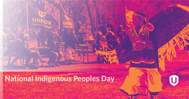 Indigenous dancer in regalia with an outdoor audience in the background.